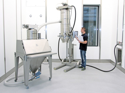 Volkmann pneumatic vacuum conveying system with sack tipping station